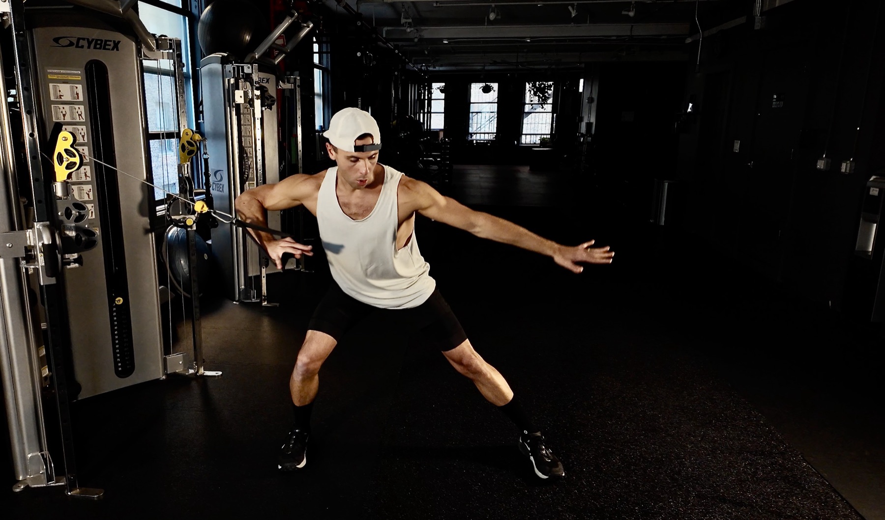 Blair performing a cable chop exercise in the gym