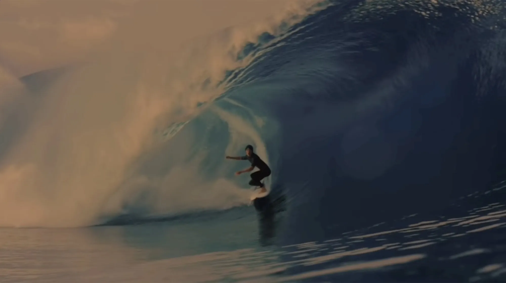 Quinn Biviano deep in a barrel at sunset
